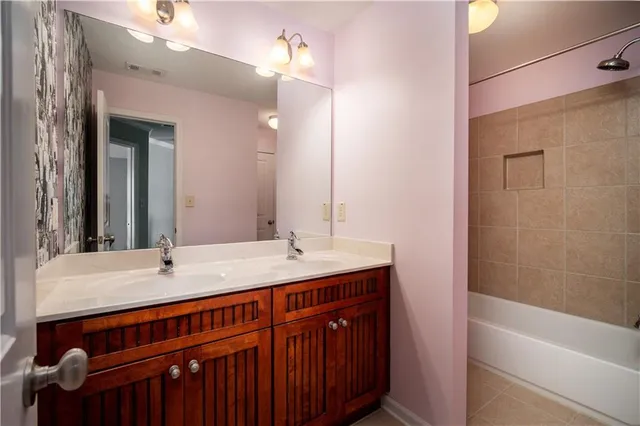 a bathroom with a sink a vanity and a mirror