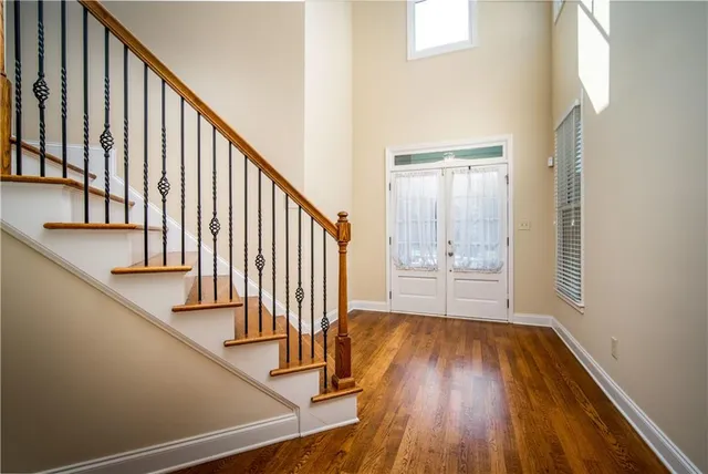 a view of an entryway with wooden floor