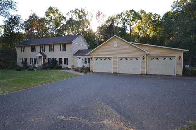 483 Moose Hill Road Monroe, CT 06468 - Photo 1 of 1 a view of a house with a yard and large trees