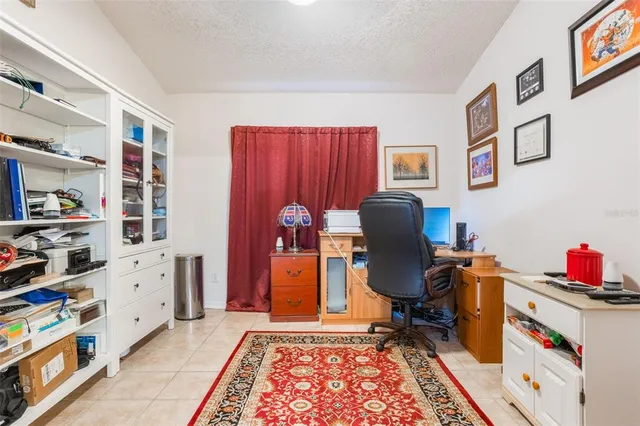 a workspace with furniture and bookshelf
