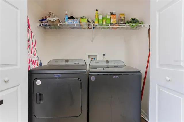 a utility room with dryer and washer