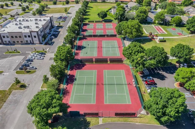 an aerial view of multiple houses with yard