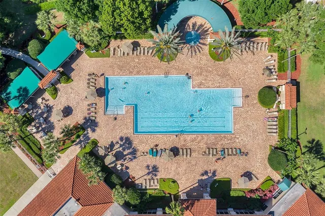 an aerial view of a house with a swimming pool