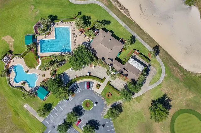 a view of swimming pool with trees