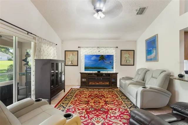 a living room with furniture and a rug