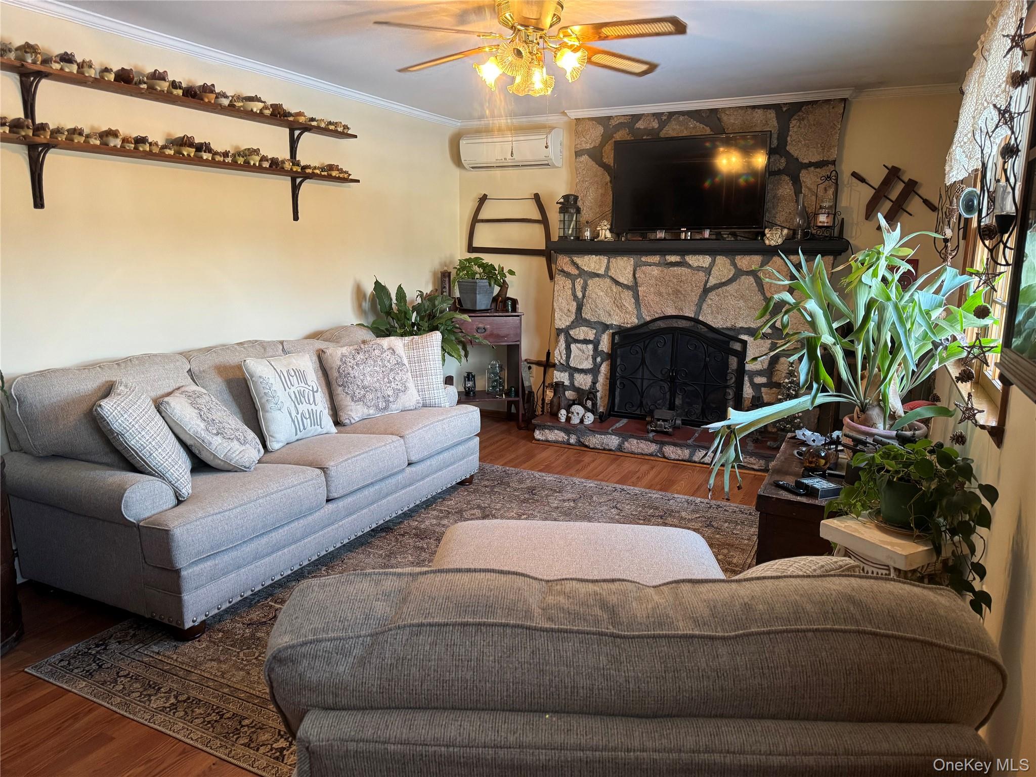 1016 Plains Road Wallkill, NY 12589 - Photo 2 of 14 a living room with furniture and a flat screen tv