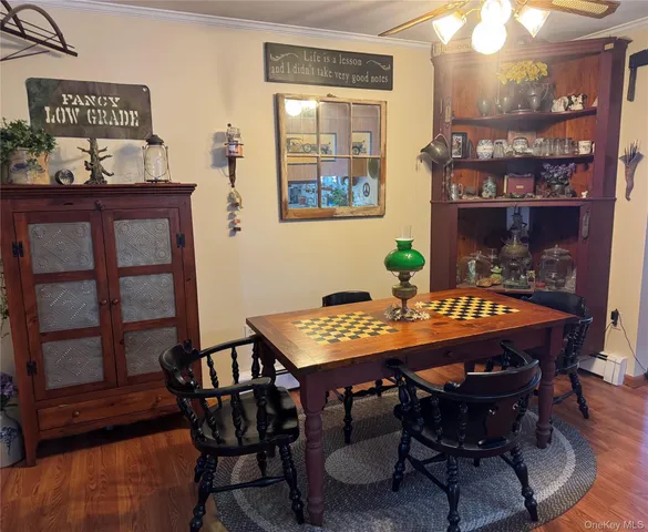 a view of a dining room with furniture and window