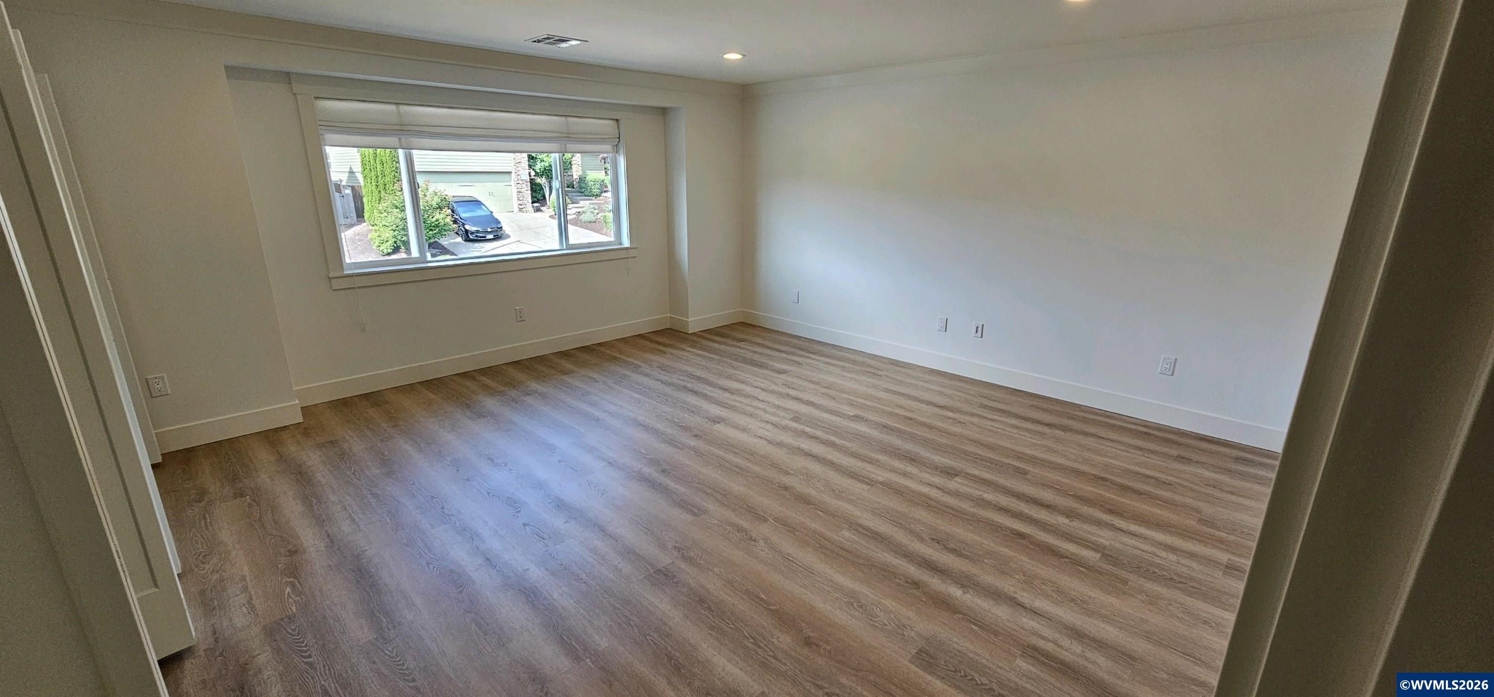 Model B Salishan Street Southeast Salem, OR 97302 - Photo 18 of 30 an empty room with wooden floor and windows
