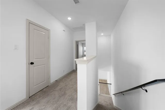 a view of a kitchen from the hallway