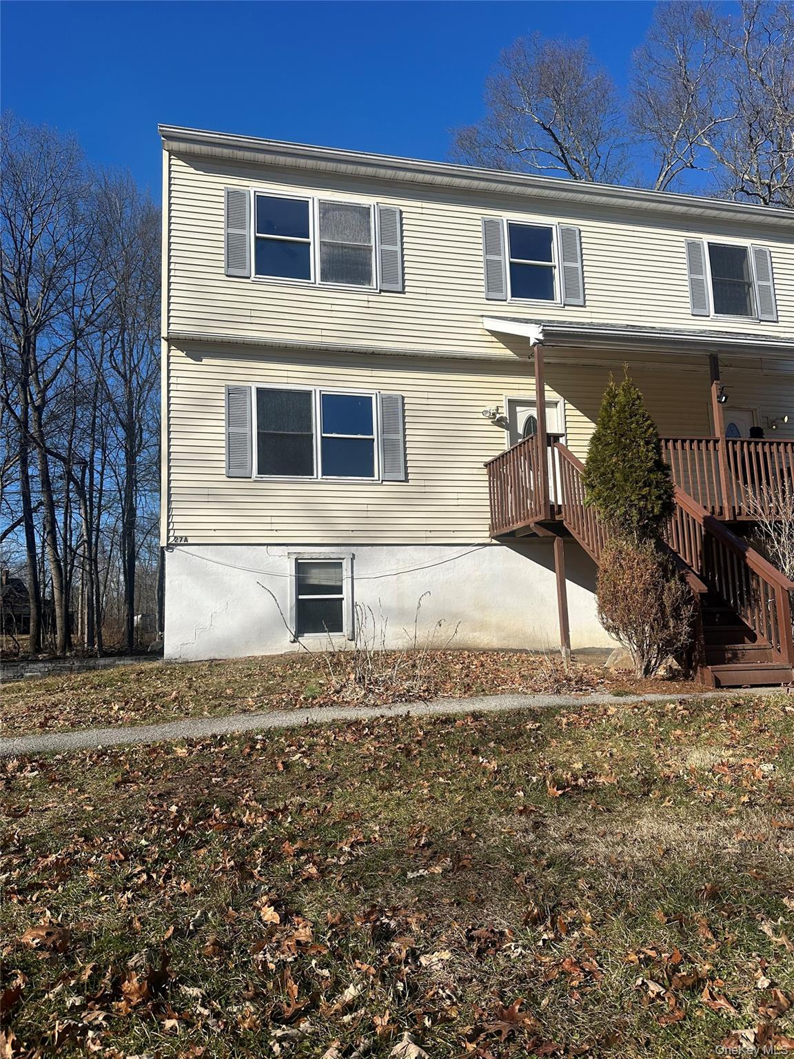27 Dandelion Lane, Unit A Wallkill, NY 12589 - Photo 16 of 16 a front view of a house with a yard