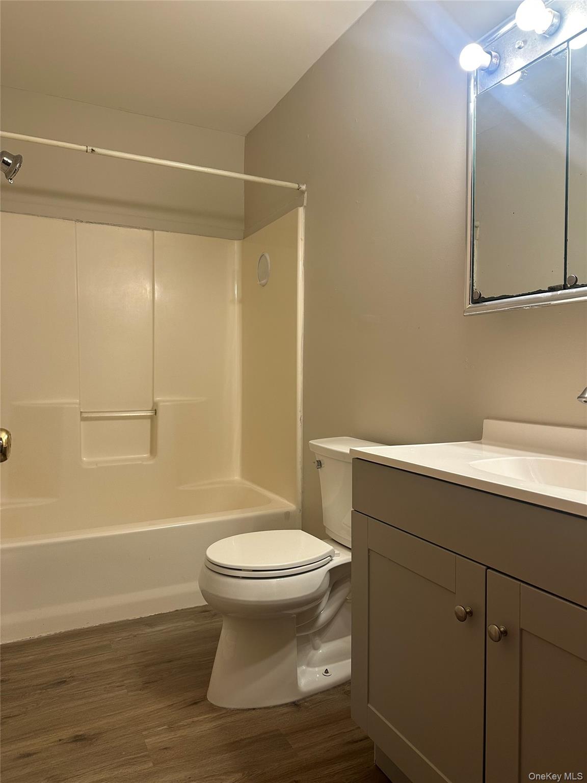 27 Dandelion Lane, Unit A Wallkill, NY 12589 - Photo 7 of 16 a bathroom with a sink a toilet and shower