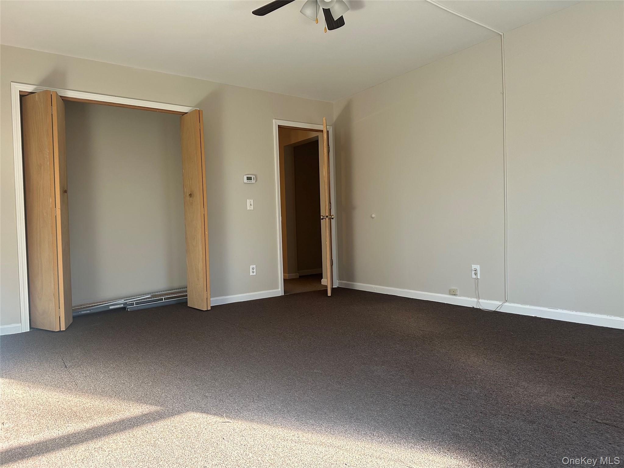 27 Dandelion Lane, Unit A Wallkill, NY 12589 - Photo 8 of 16 a view of an empty room with a closet
