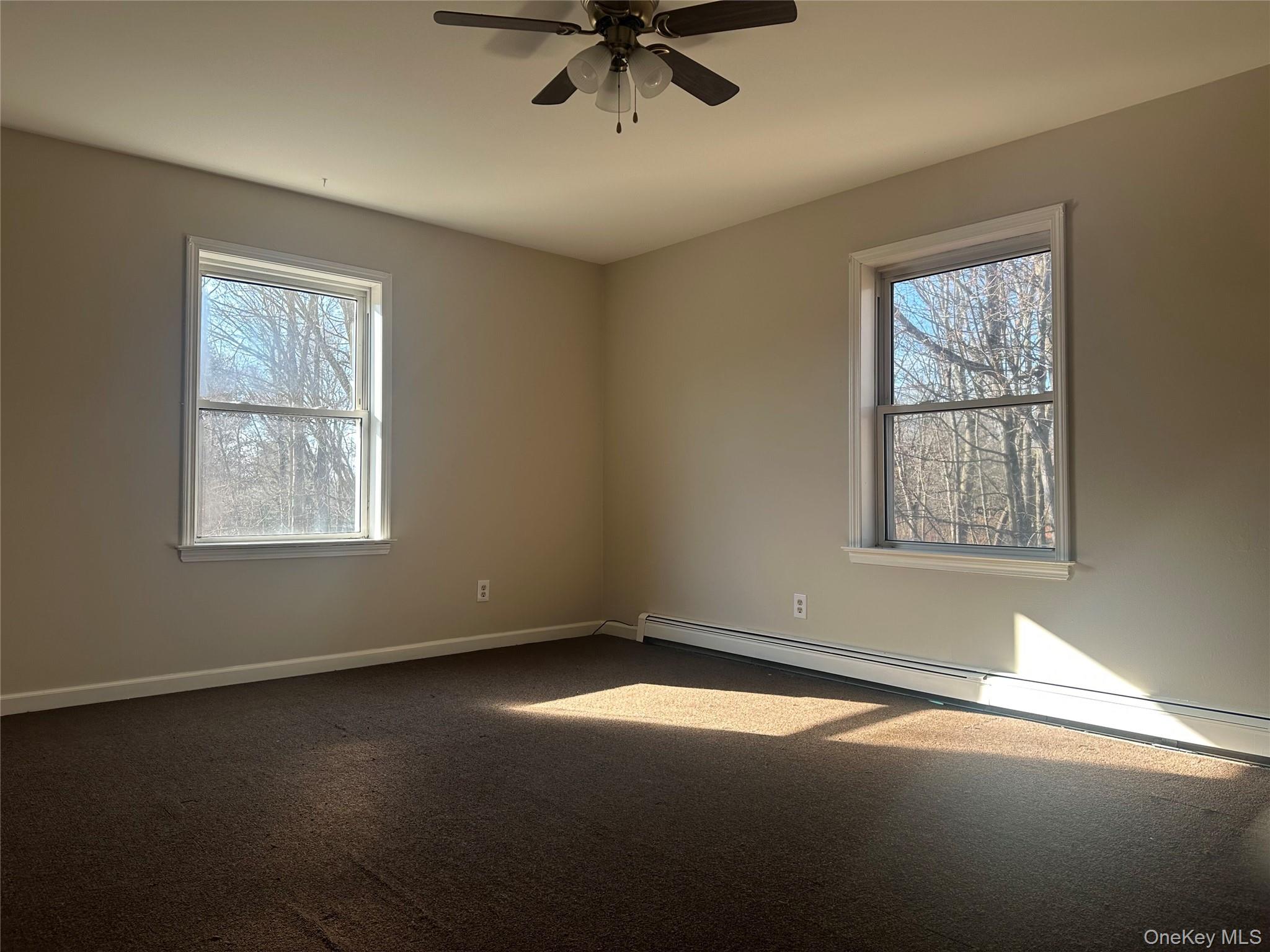 27 Dandelion Lane, Unit A Wallkill, NY 12589 - Photo 9 of 16 a view of an empty room with a window