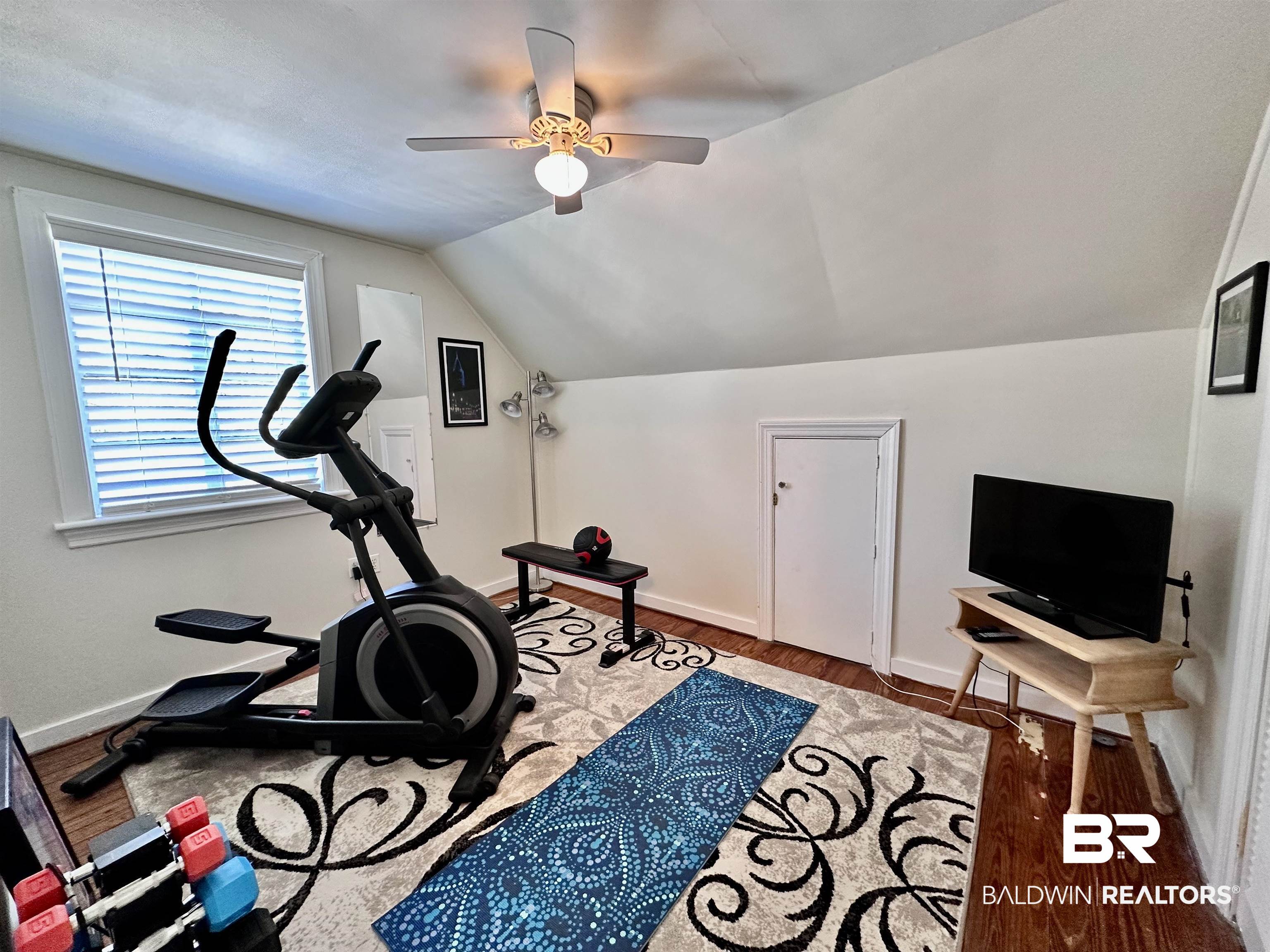 260 Siena Vista Street Mobile, AL 36607 - Photo 30 of 41 Exercise room featuring vaulted ceiling, a ceiling fan, baseboards, and wood finished floors