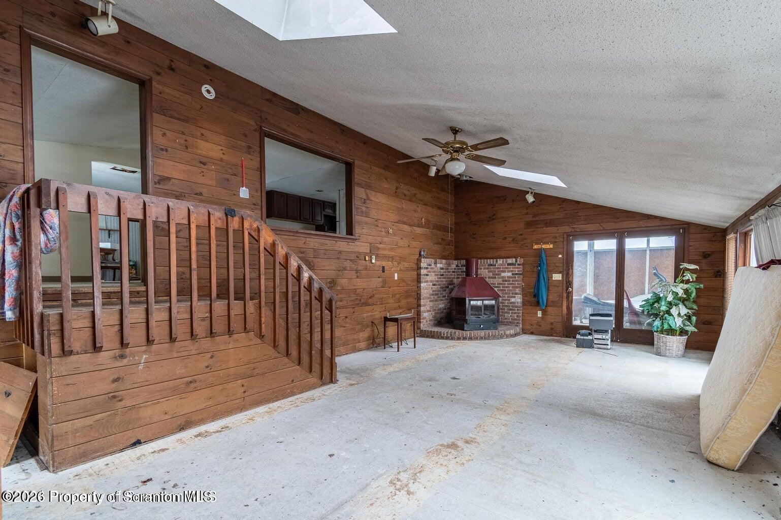 1777 Lamb Road Thompson, PA 18465 - Photo 7 of 31 a view of a chairs with porch in front of house