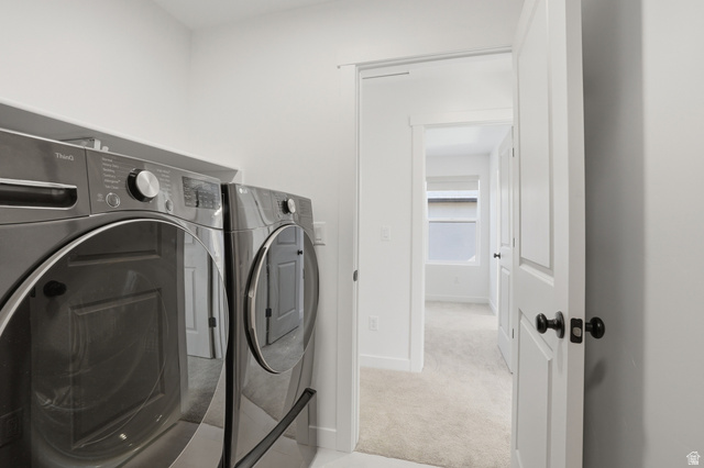 11531 Engelmann Drive Draper, UT 84020 - Photo 18 of 31 Dedicated laundry area with modern front-loading washer and dryer units