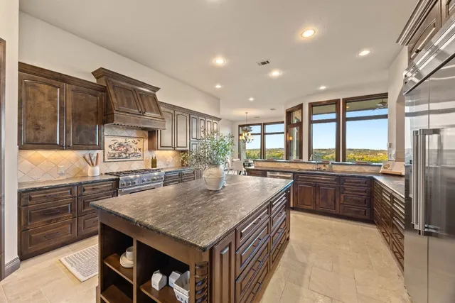 a dining room with furniture a chandelier and wooden floor