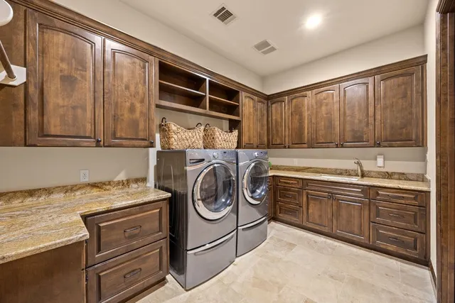 an empty room with windows and ceiling fan