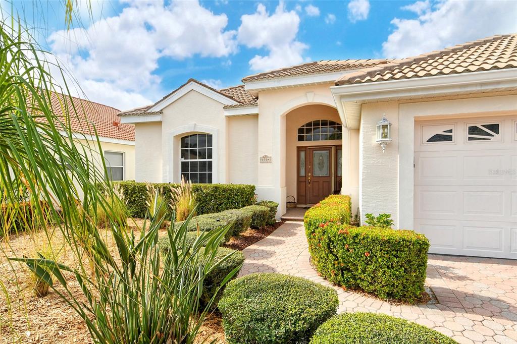 Front exterior with mature landscaping