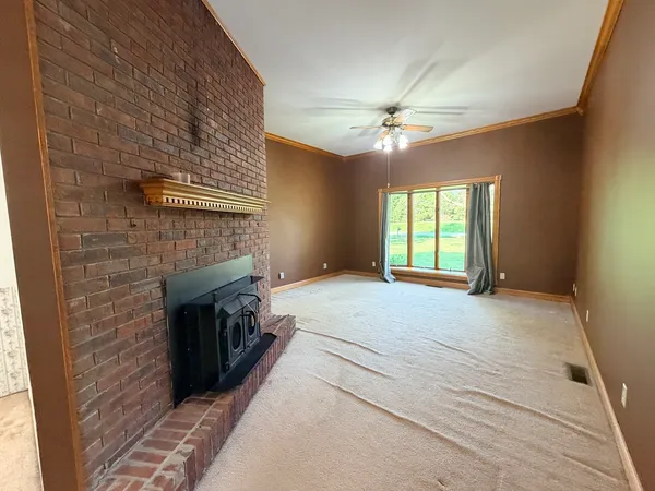 a spacious bedroom with a bed and a fireplace