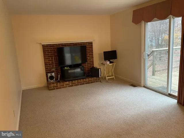 a view of a glass door with a tree