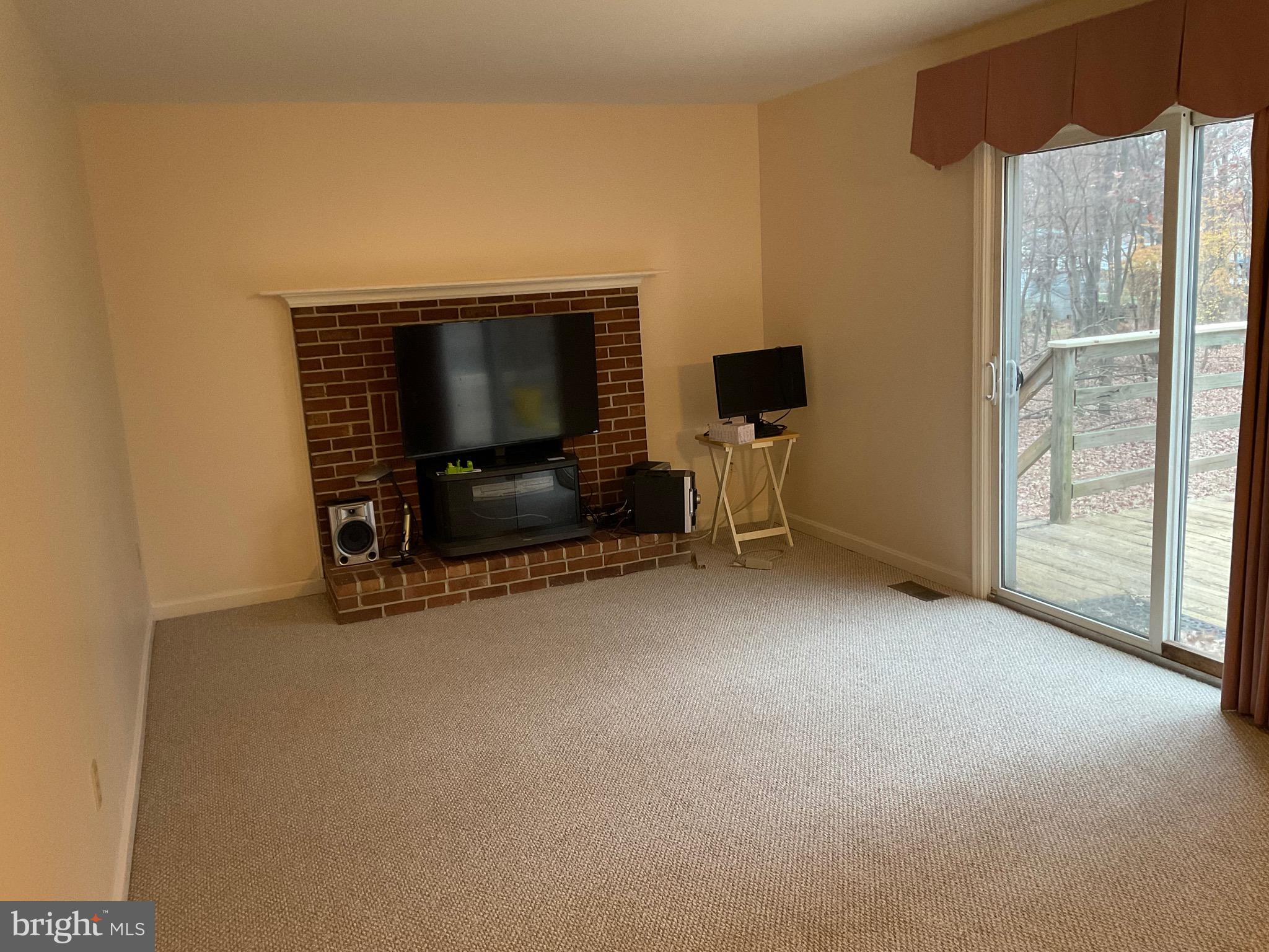 6801 Upper Mills Circle Baltimore, MD 21228 - Photo 14 of 40 a view of livingroom with furniture and a flat screen tv