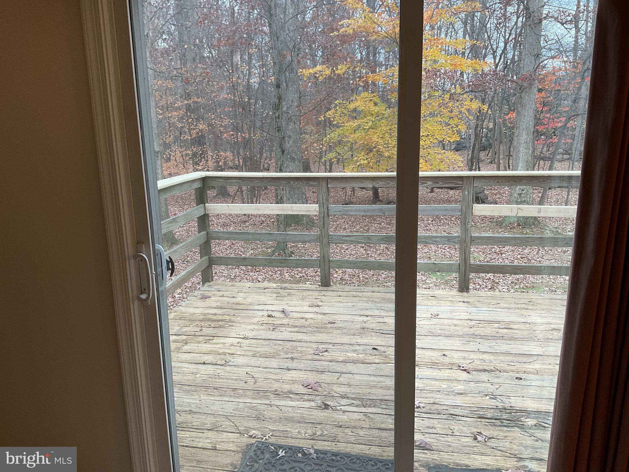 6801 Upper Mills Circle Baltimore, MD 21228 - Photo 15 of 40 a view of a glass door with a tree