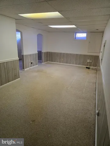 a view of an empty room and a window