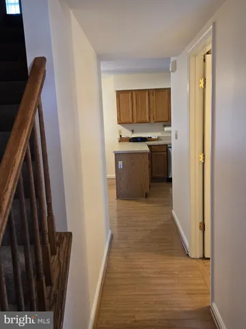 a view of a kitchen from the hallway