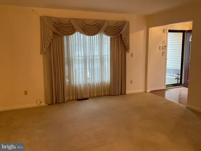 a view of an empty room with a sliding door