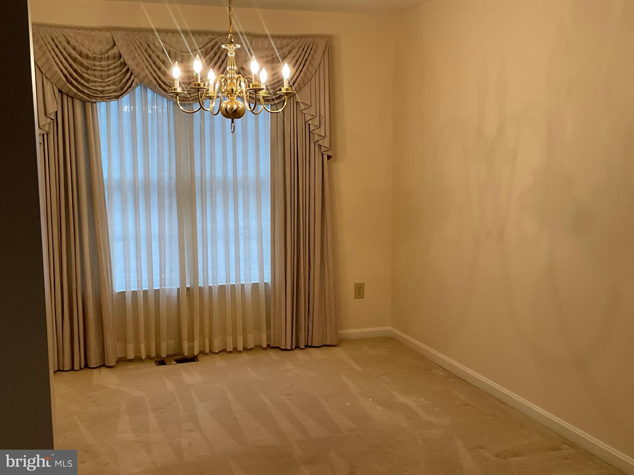 6801 Upper Mills Circle Baltimore, MD 21228 - Photo 7 of 40 a view of a chandelier in a room