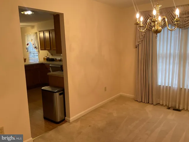 a kitchen with a sink appliances and cabinets