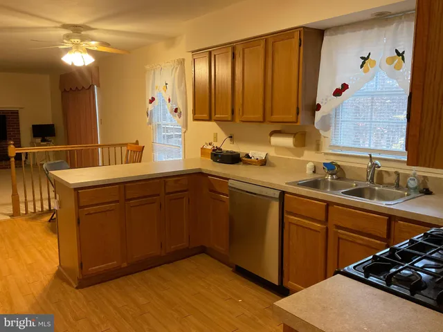 a view of a livingroom with furniture and a flat screen tv