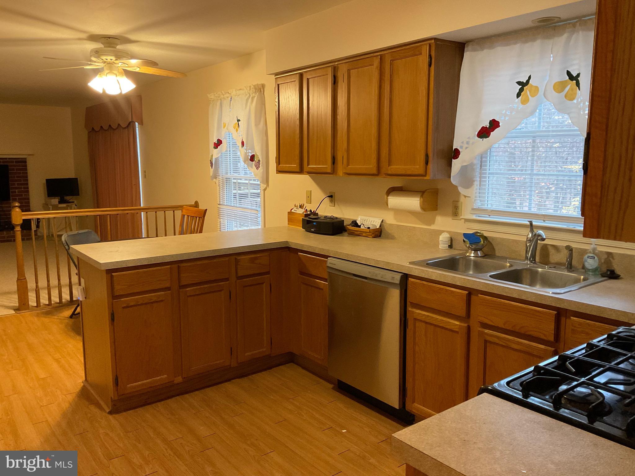 6801 Upper Mills Circle Baltimore, MD 21228 - Photo 10 of 40 a kitchen with a sink and cabinets