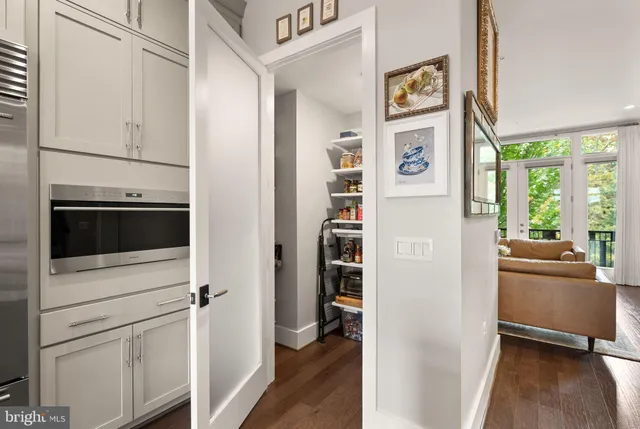 a living room with furniture a window and a table