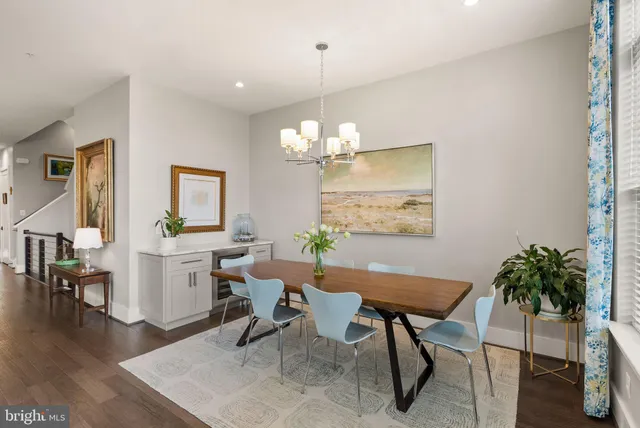 a bedroom with a large window and a bed