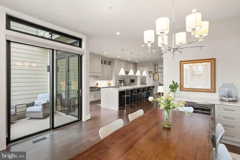 a bedroom with a bed and painting on the wall