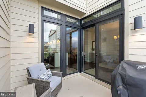 a white bath tub sitting next to a shower