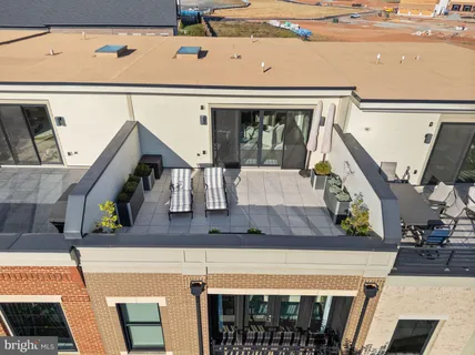 a kitchen with stainless steel appliances granite countertop a sink a stove and a window