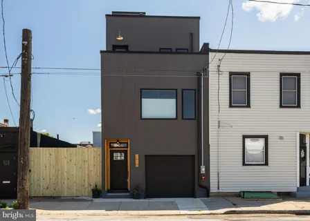 a front view of a house with parking