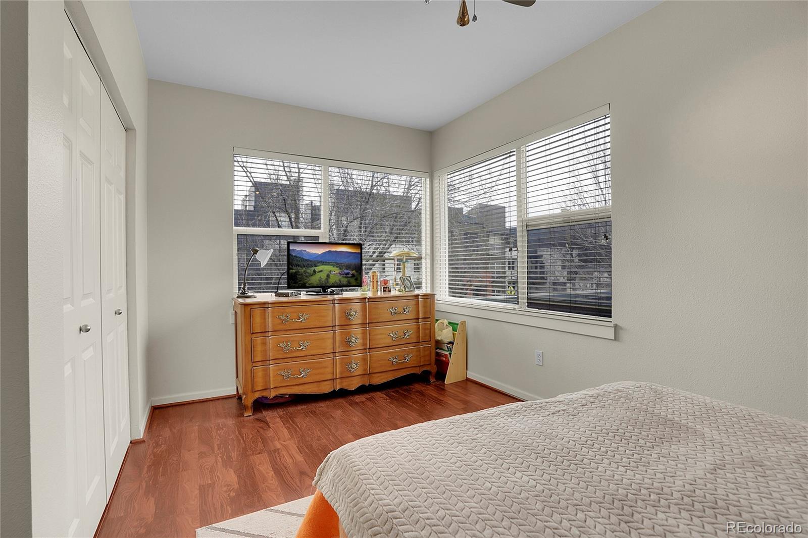 2848 Syracuse Street, Unit 128 Denver, CO 80238 - Photo 12 of 15 a bedroom with a bed and a window