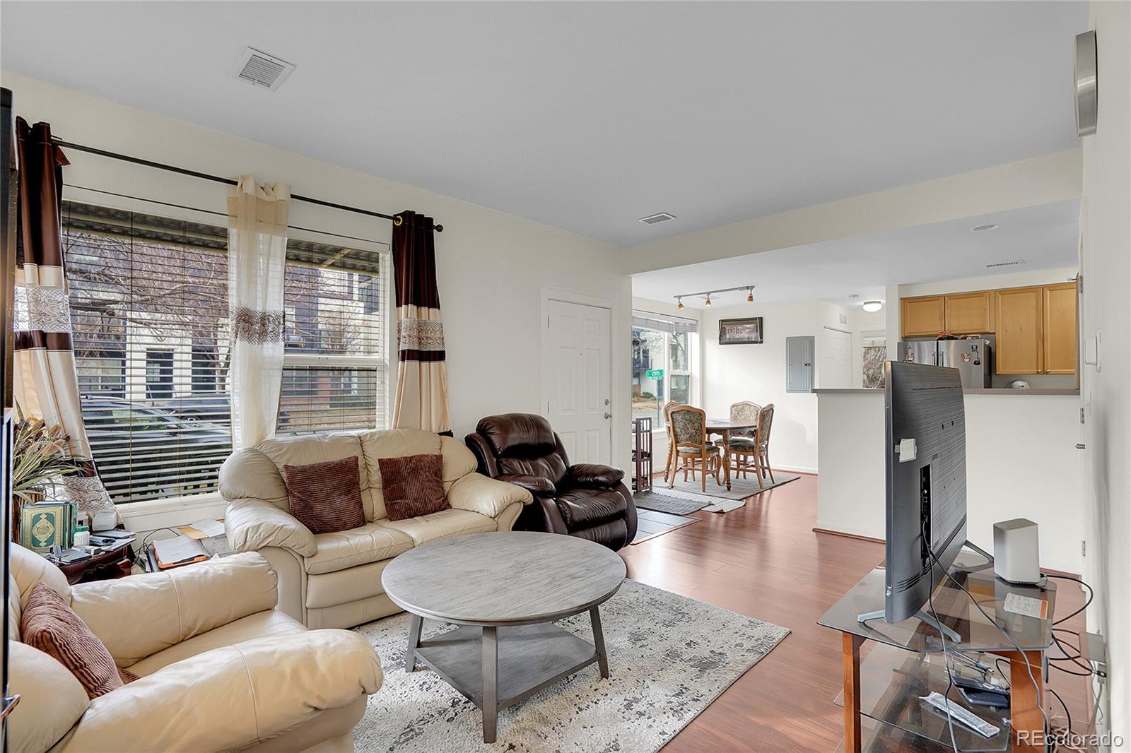 2848 Syracuse Street, Unit 128 Denver, CO 80238 - Photo 5 of 15 a living room with furniture and a window