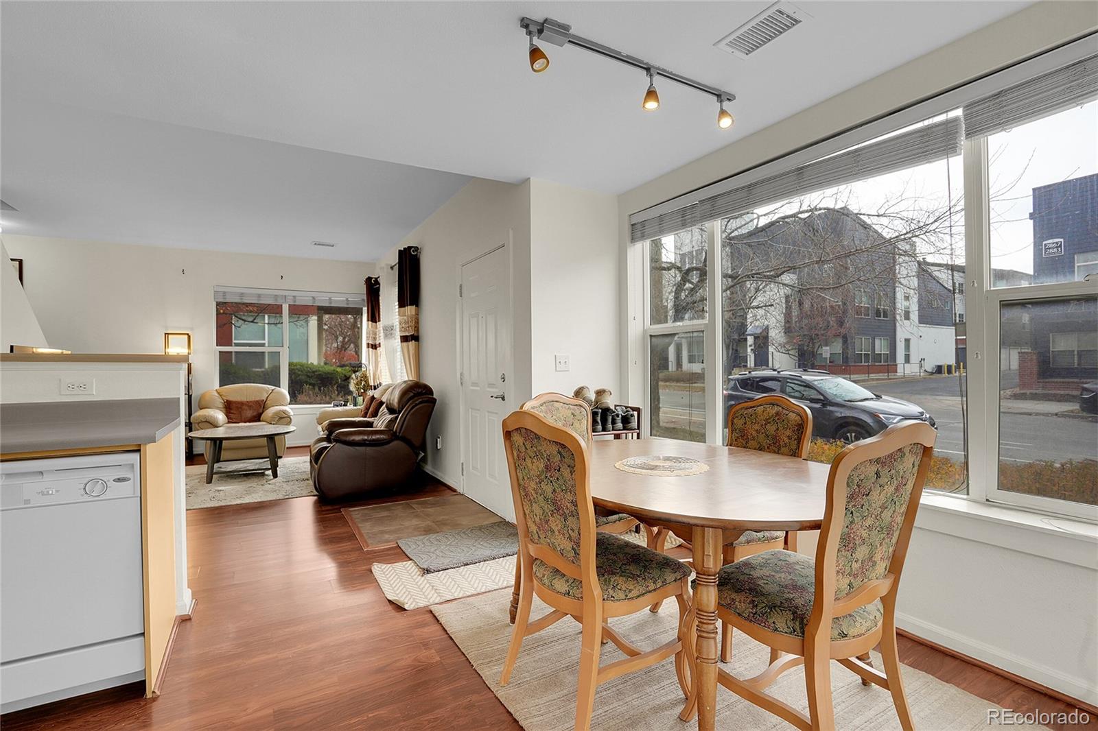 2848 Syracuse Street, Unit 128 Denver, CO 80238 - Photo 7 of 15 a view of a dining room with furniture window and outside view