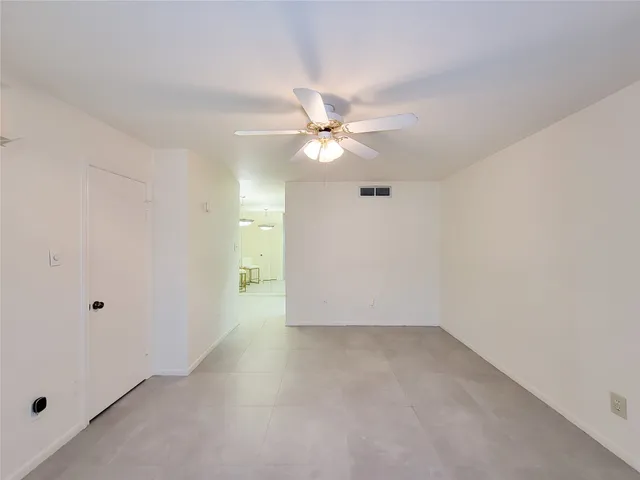 a view of a livingroom with furniture and a chandelier