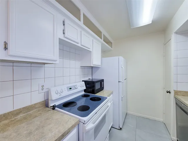 a bathroom with a sink and vanity
