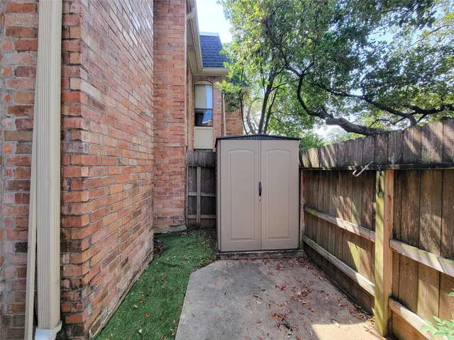 a view of a brick wall of the building
