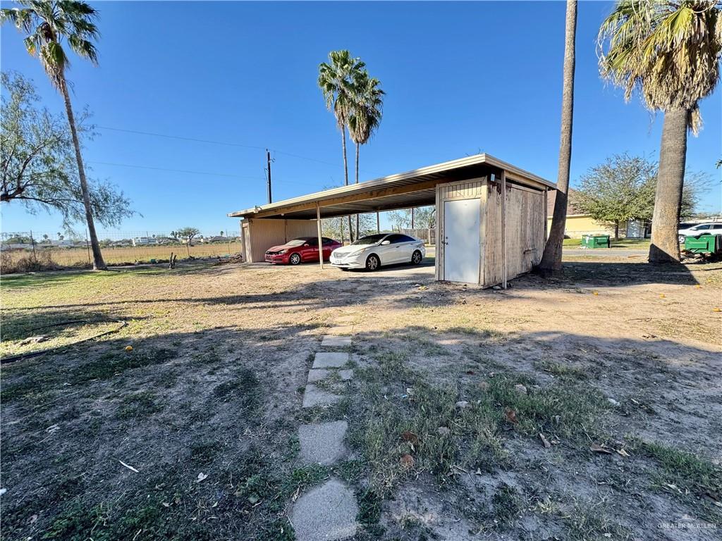 2708 Howard Drive, Unit E3 McAllen, TX 78503 - Photo 26 of 30 a view of a house with backyard and trees