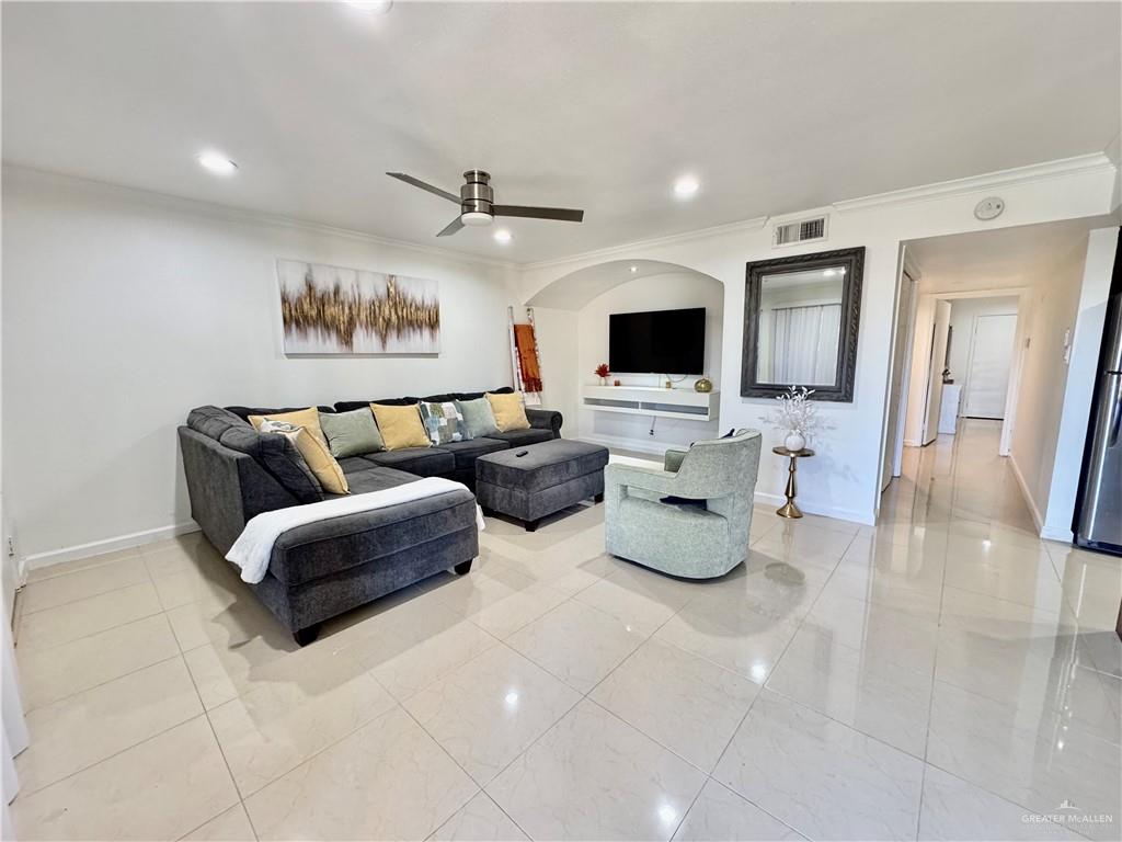 2708 Howard Drive, Unit E3 McAllen, TX 78503 - Photo 5 of 30 a living room with furniture and a flat screen tv
