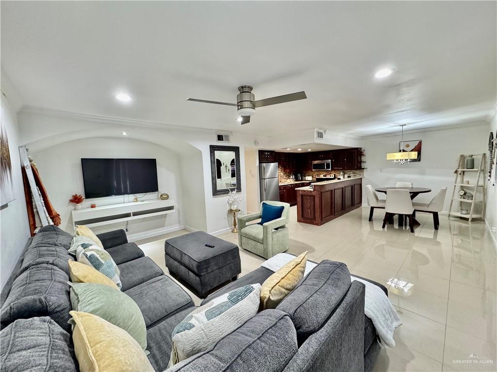 2708 Howard Drive, Unit E3 McAllen, TX 78503 - Photo 6 of 30 a living room with furniture and a flat screen tv