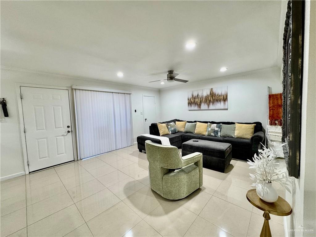 2708 Howard Drive, Unit E3 McAllen, TX 78503 - Photo 7 of 30 a living room with furniture and a potted plant